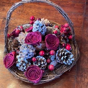 Beautiful rose and pine cone centerpiece basket.